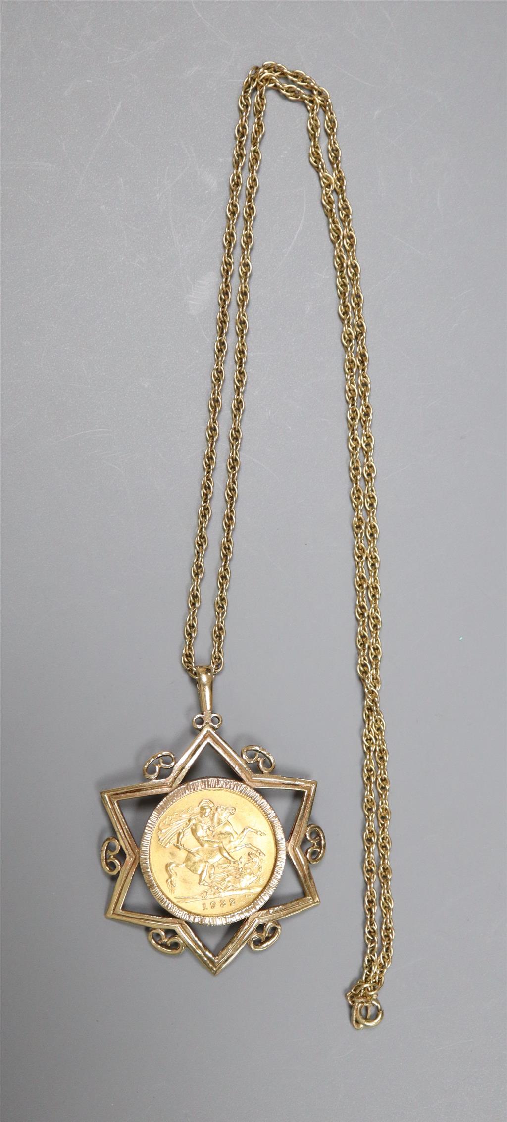 A 1932 gold sovereign, Pretoria Mint, in Star of David 9ct gold mount on yellow metal chain,